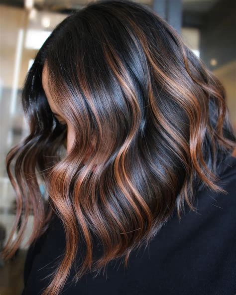 caramel balayage on dark hair.